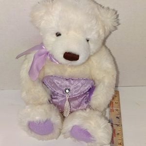 A beautiful white and lavender gund  teddy bear